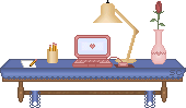 blinkie rack desk with laptop and lamp