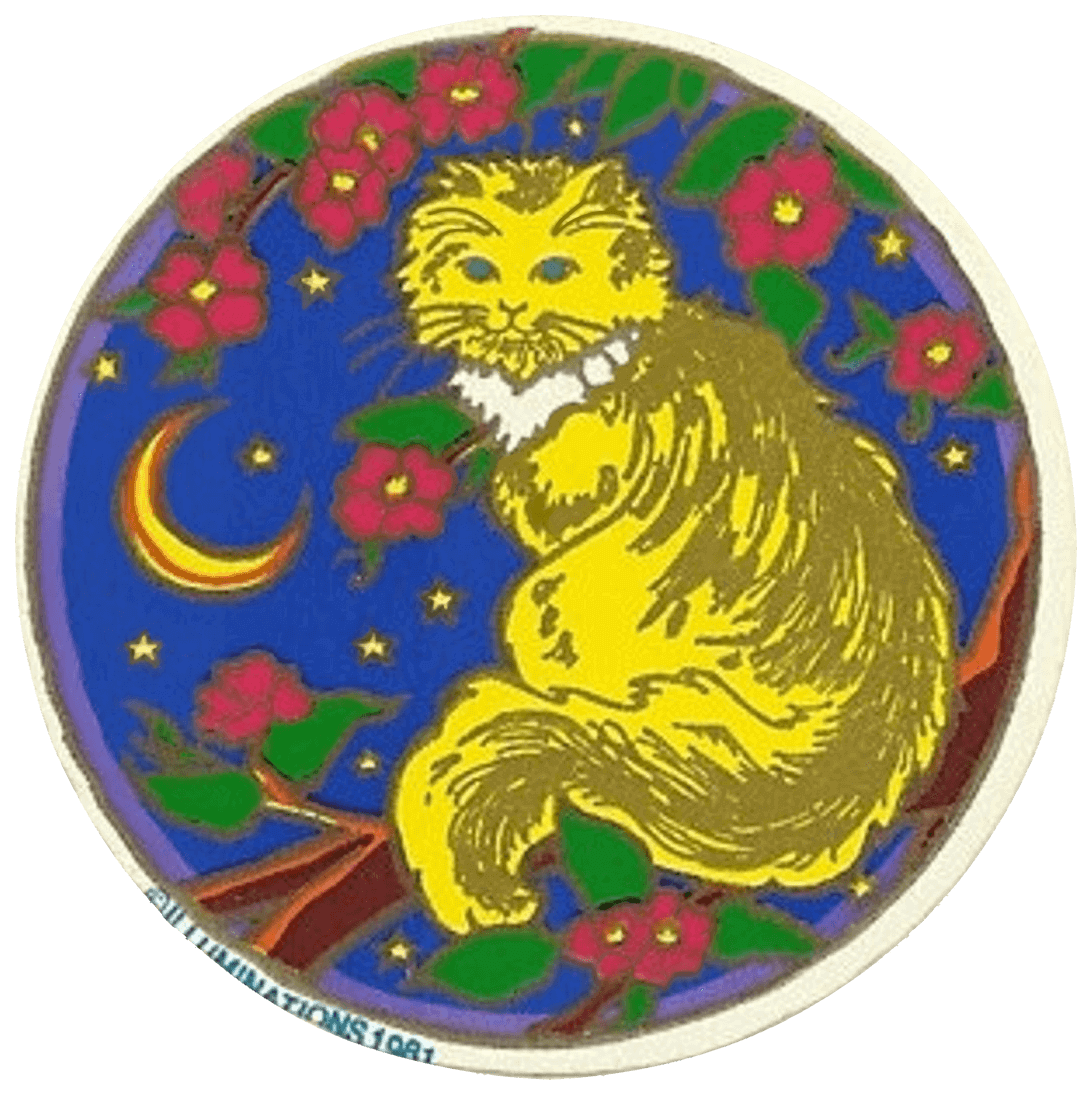 cat sitting in a tree with red flowers