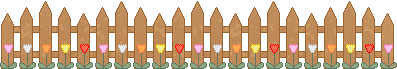 brown picket fence with tulips